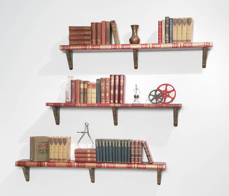 three large shelves from encyclopedias